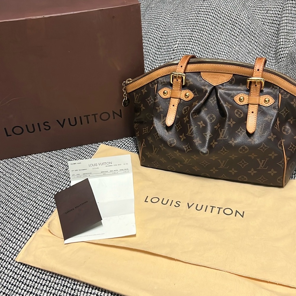 Authentic Louis Vuitton Tivoli GM 
With box, dust cover, and original receipt.